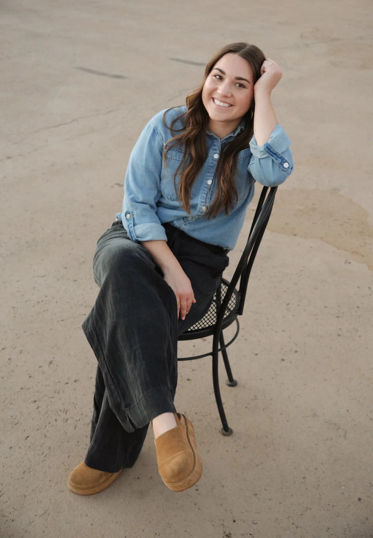 Faith Vargas seated outdoors, smiling